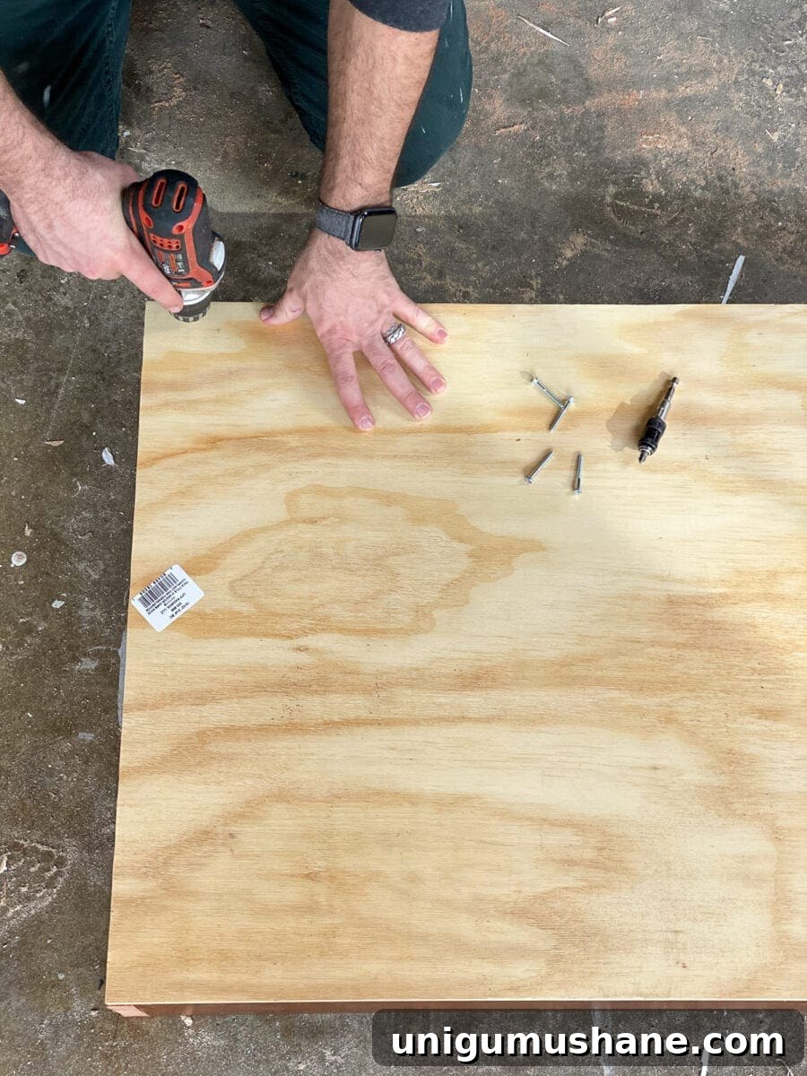 Build a Vertical Wall Planter from Reclaimed Wood 6 DIY Vertical Wall Planter | Adding plywood back