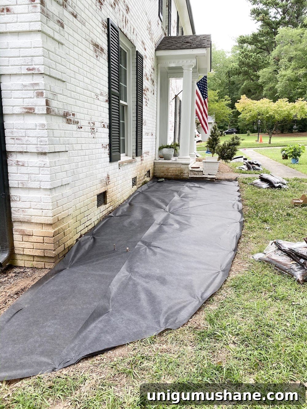 Landscape fabric secured with staples