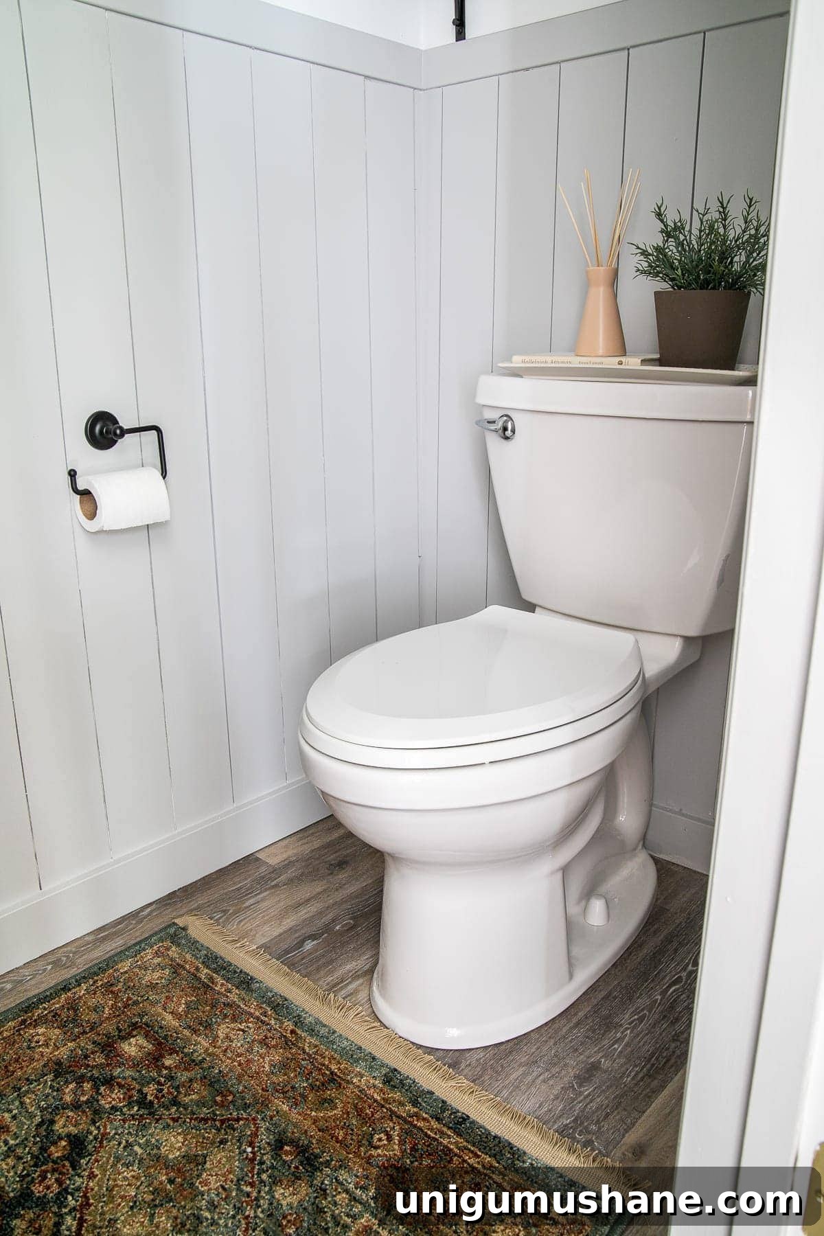 California Casual Powder Room Makeover: Before and After 14 small bathroom with vertical shiplap and vintage style rug