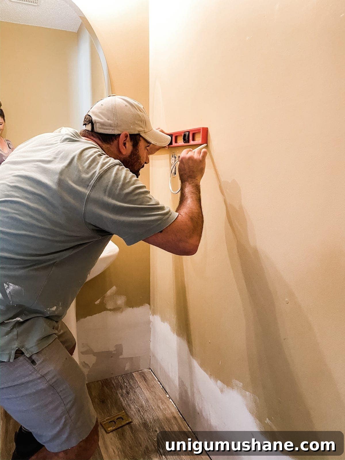 DIY Vertical Shiplap Wainscoting for Bathroom Walls 5 marking a wall with a level for shiplap placement