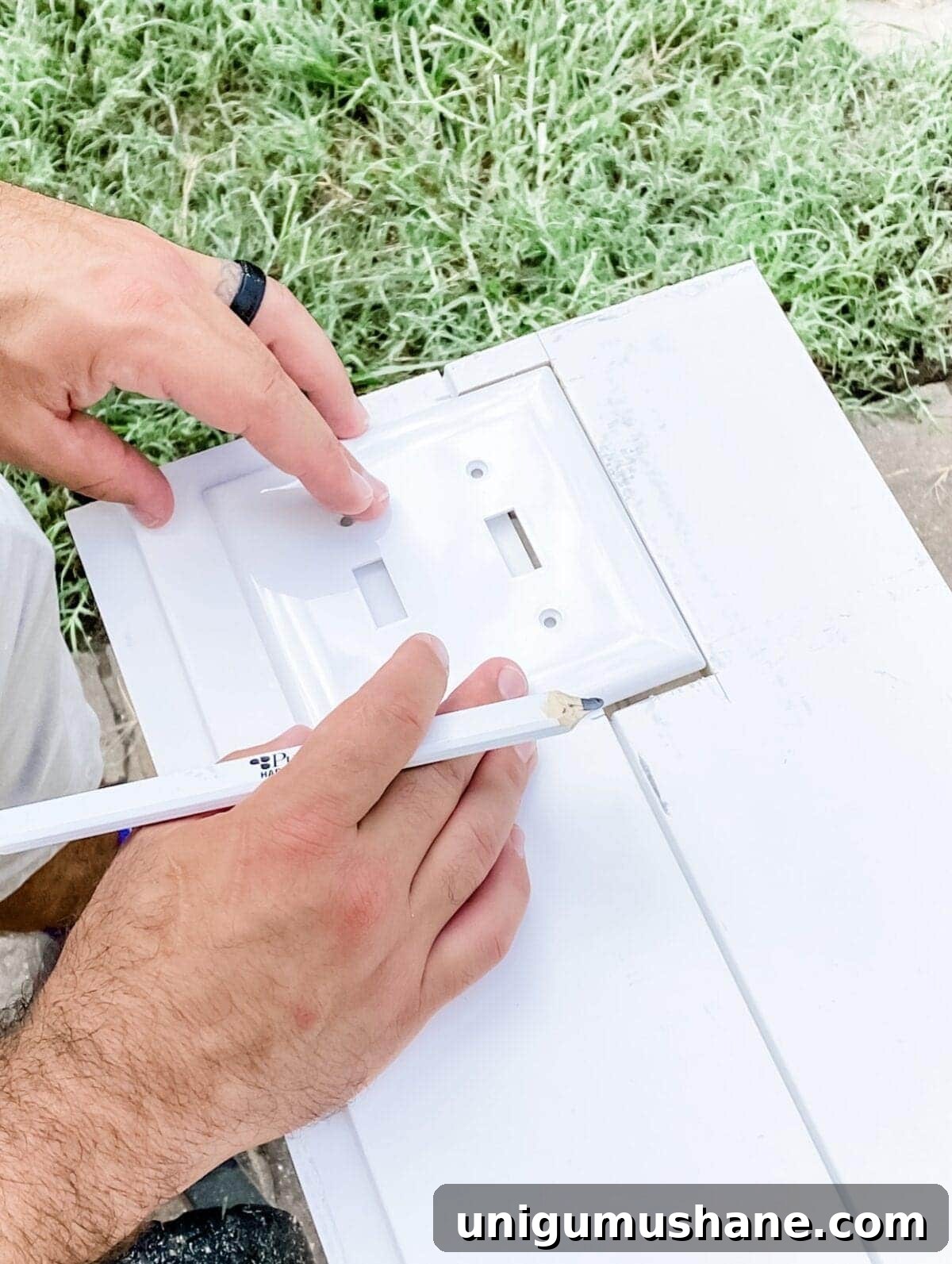 DIY Vertical Shiplap Wainscoting for Bathroom Walls 8 tracing an outlet cover on shiplap boards