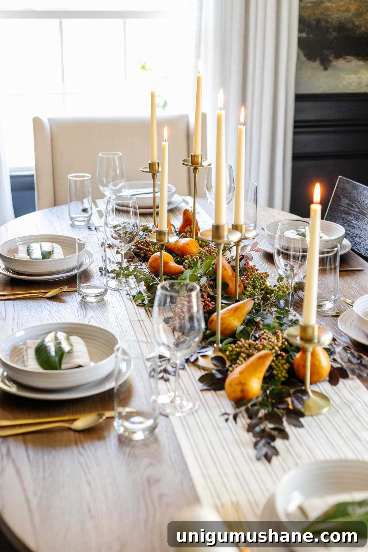 DIY Fall Decor Projects to Make Your Home Cozy 14 cozy fall table using leaves, candles, and pears as a simple fall centerpiece