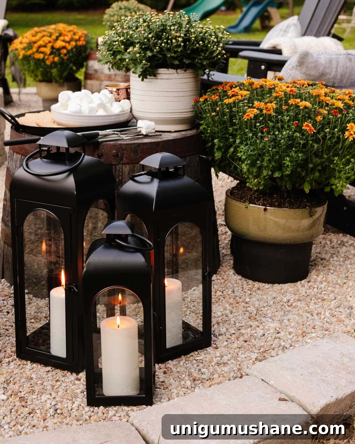 DIY Fall Decor Projects to Make Your Home Cozy 18 lanterns in a backyard around a cozy fire pit