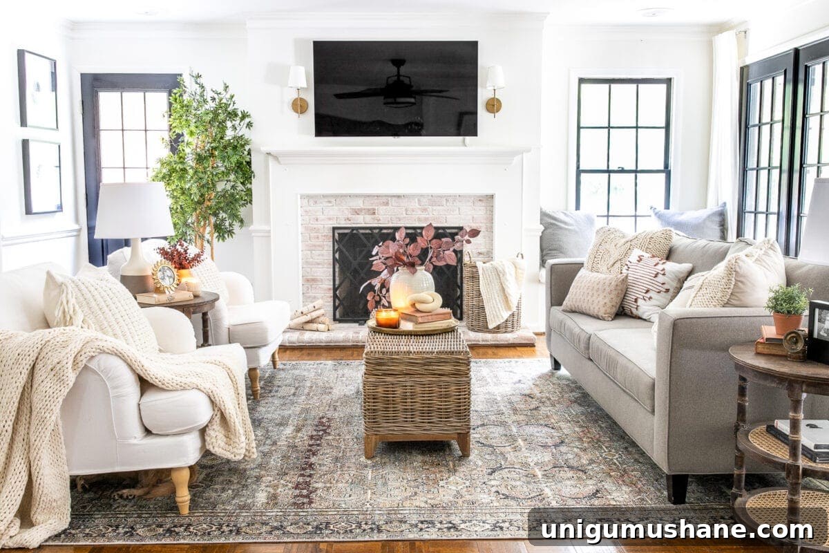 fall living room with tv above fireplace