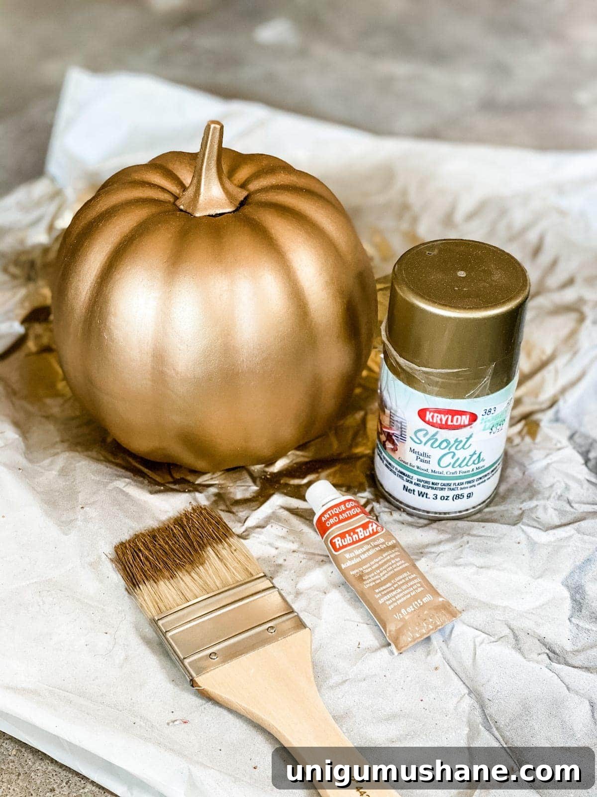 3 Modern Pumpkin Painting Ideas for Chic Fall Decor 4 fake pumpkin painted to look like aged brass