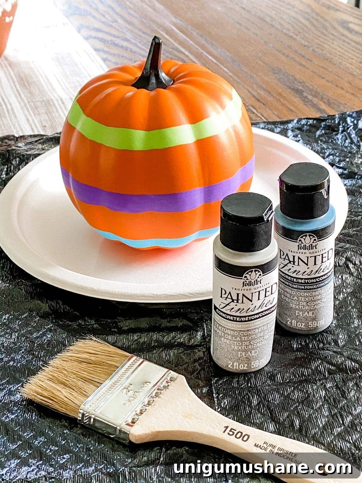 3 Modern Pumpkin Painting Ideas for Chic Fall Decor 6 fake pumpkin painted to look like concrete