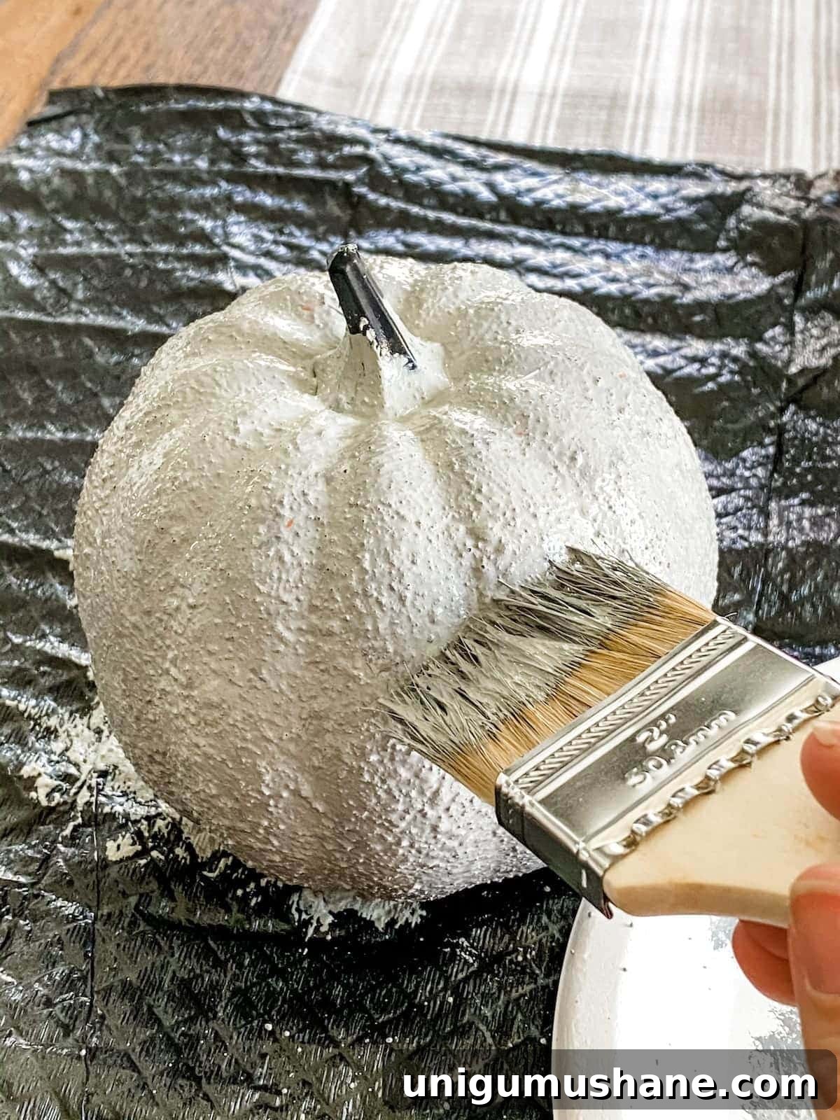 3 Modern Pumpkin Painting Ideas for Chic Fall Decor 7 fake pumpkin with concrete paint