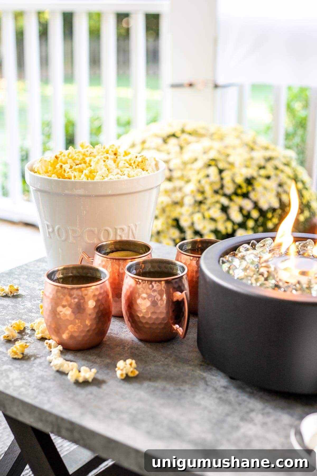 DIY Fall Porch Outdoor Movie Screen and S'mores Table 7 Copper mugs, popcorn, and fire bowl