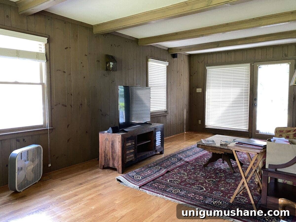 McNay Project: Tour a Modern Coastal Living Room 2 Before living room with beams and planked walls