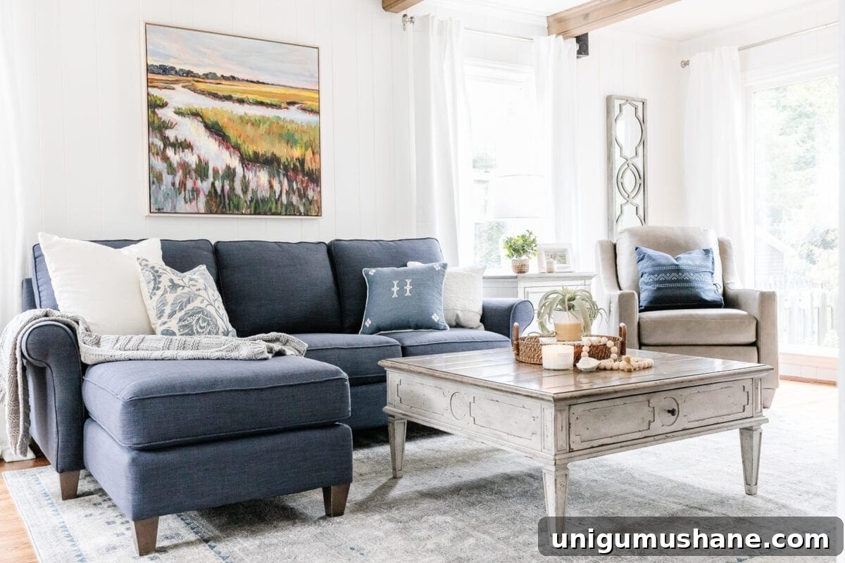 McNay Project: Tour a Modern Coastal Living Room 13 Marsh painting above sofa and rug