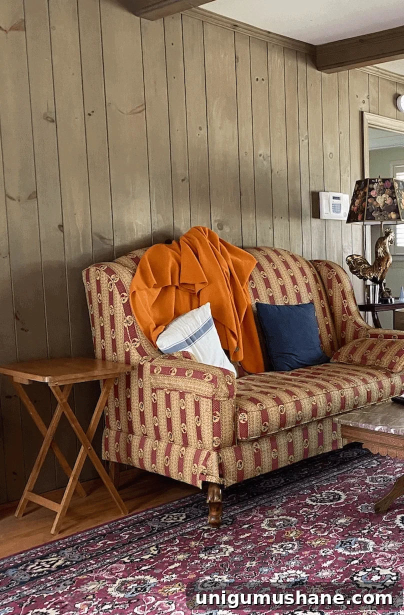 McNay Project: Tour a Modern Coastal Living Room 6 TV wall with framed sketches and sconces