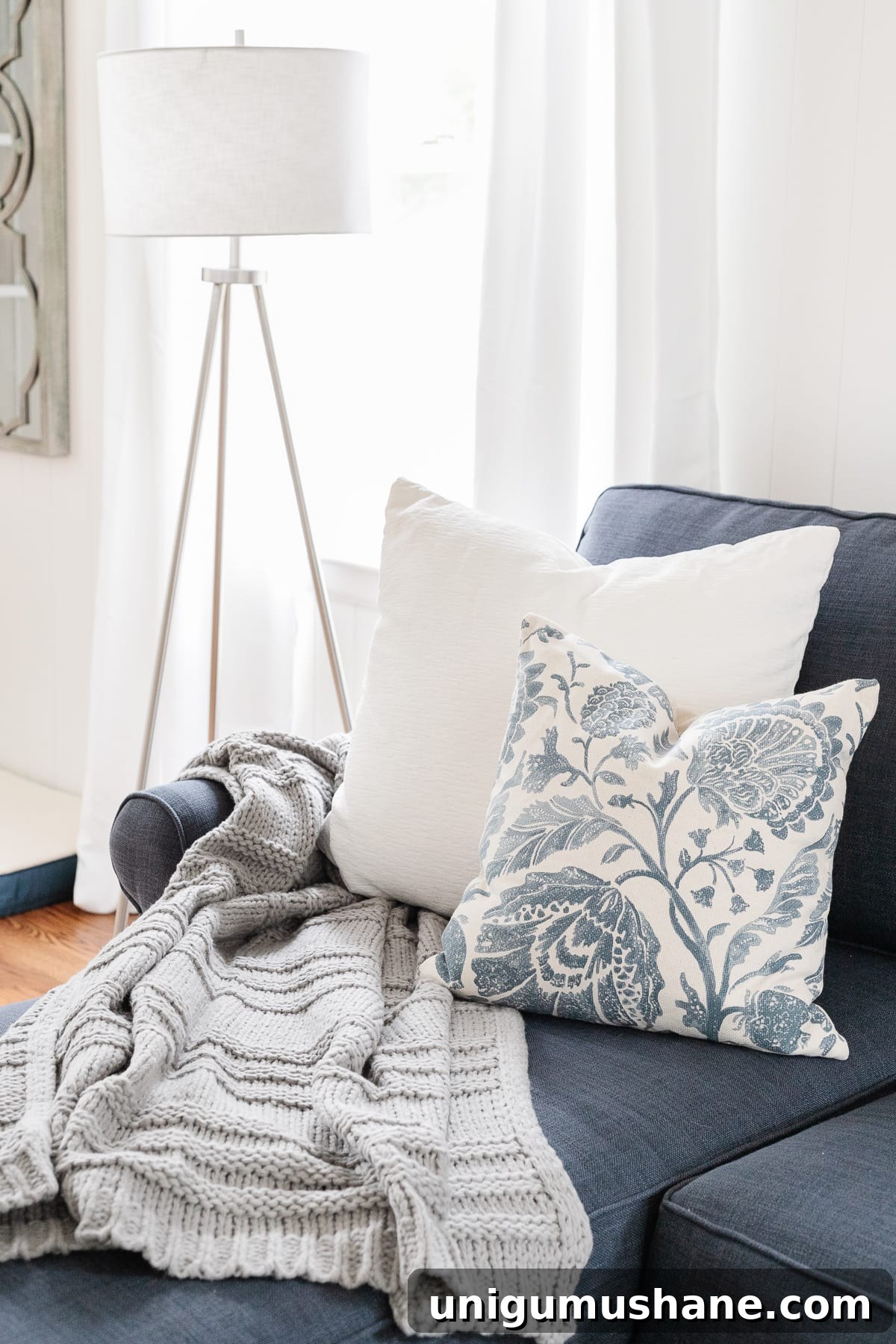 McNay Project: Tour a Modern Coastal Living Room 10 Styled sofa with pillows and lamp