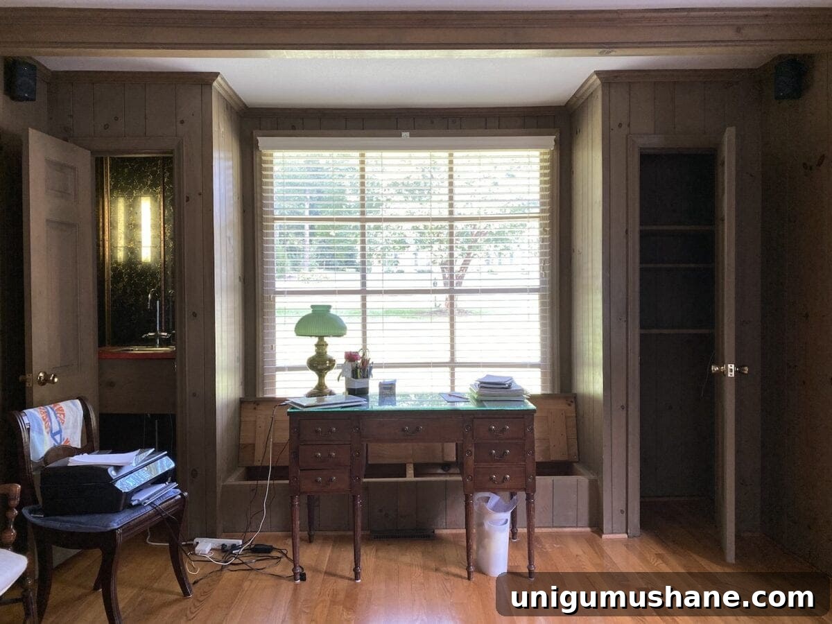 Turn a Closet Into Built In Shelving 2 office in living room with wood paneling