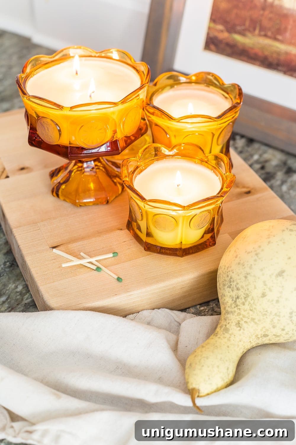 14 Fall Decor Finds to Shop at Thrift Stores 3 upcycled amber glass DIY candles