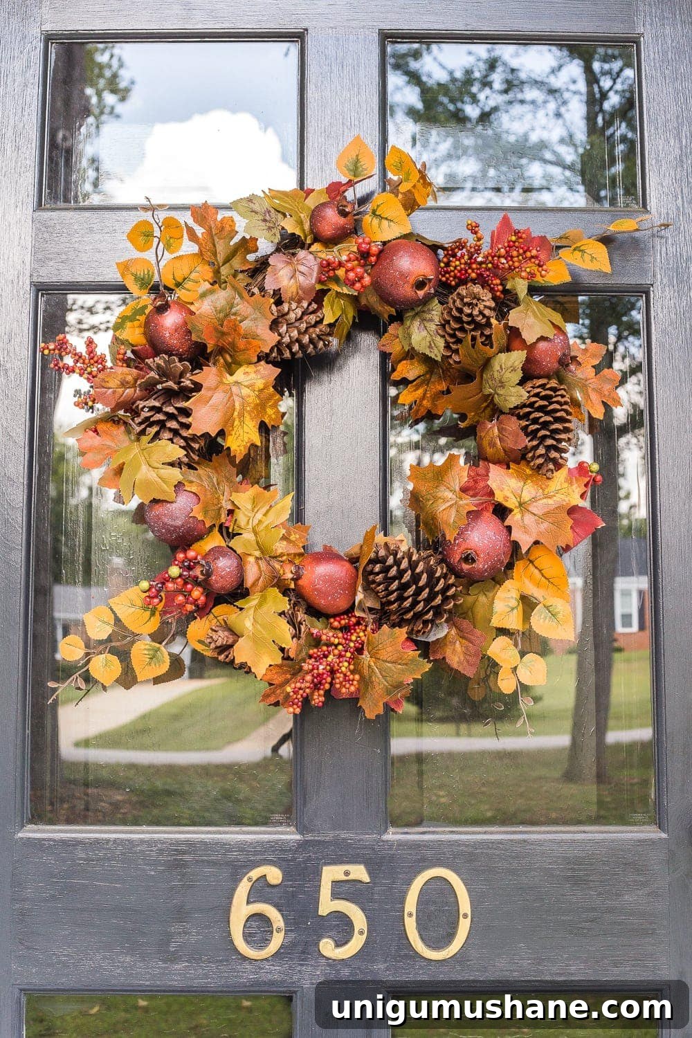 14 Fall Decor Finds to Shop at Thrift Stores 5 fall wreath with traditional colors in gold and rust
