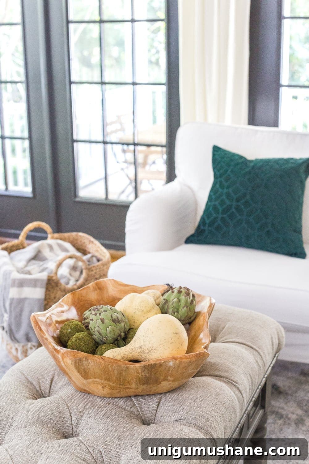 14 Fall Decor Finds to Shop at Thrift Stores 8 wooden bowl of gourds and artichokes on a living room coffee table