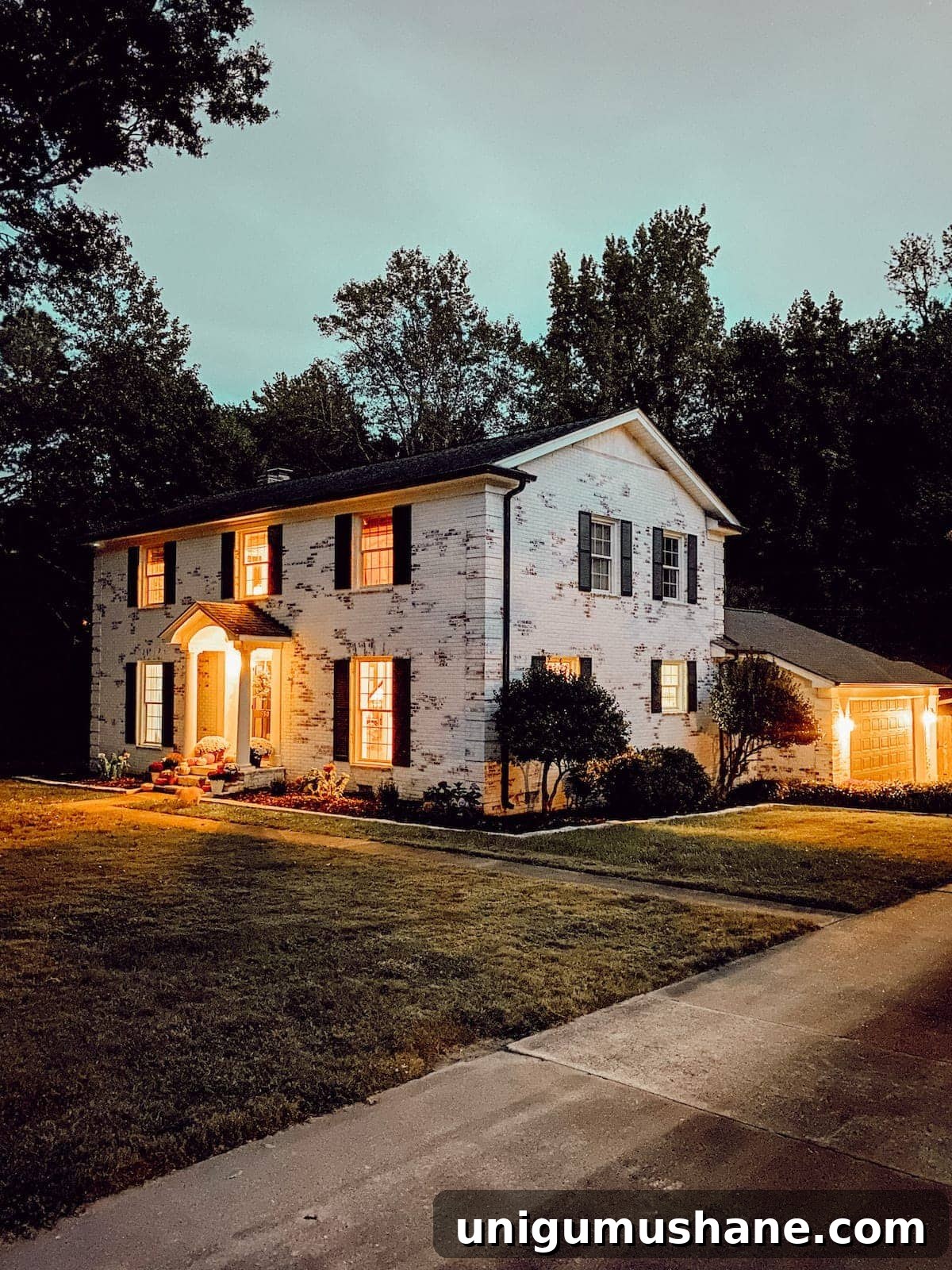 Colorful Fall Porch Stoop Decor for a Cozy Entryway 6 limewashed brick colonial house at night