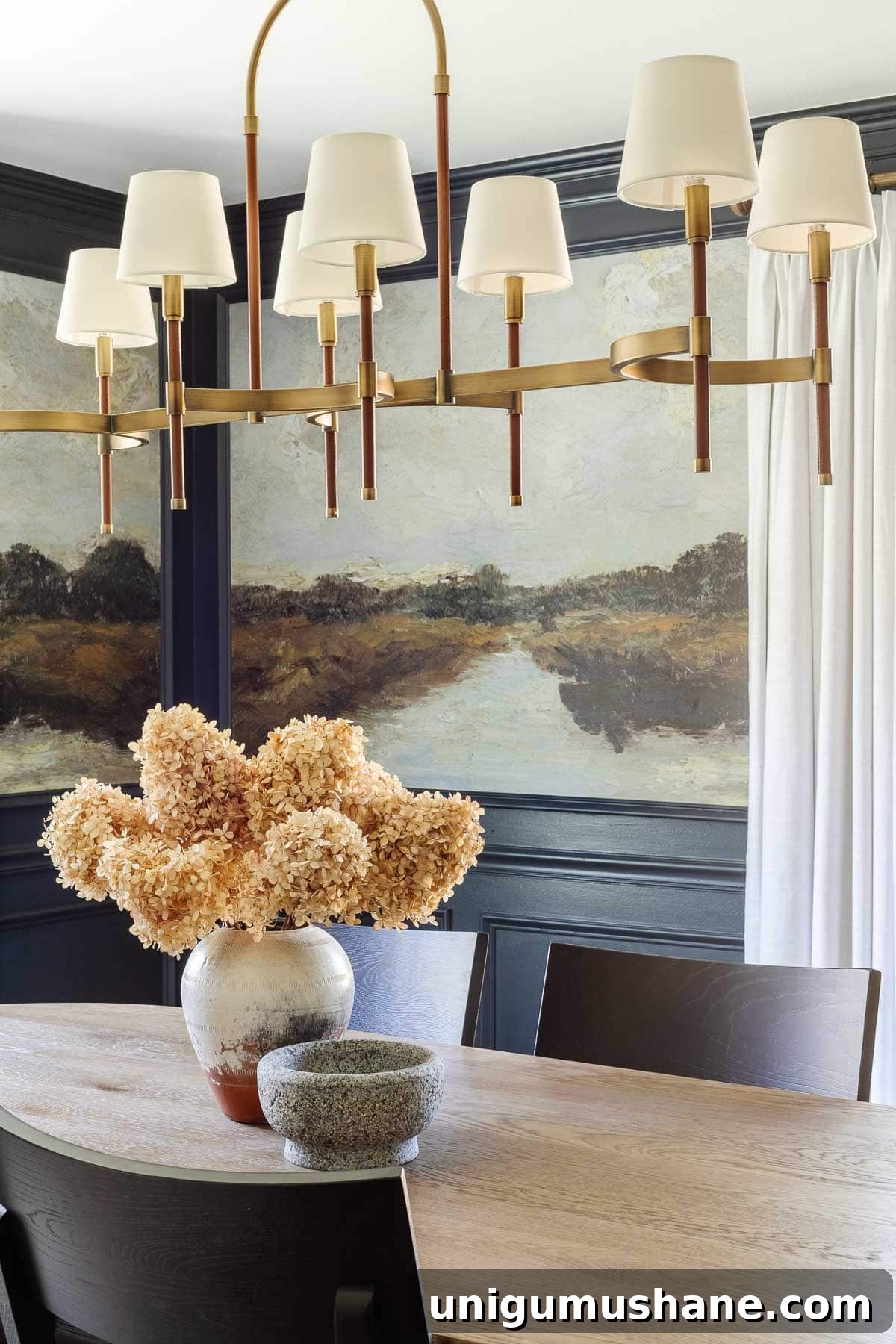 Preserved Flowers: Drying Leaves and Blooms for Home Decor 4 preserved hydrangea flowers in a vase on a dining room table for a simple fall centerpiece