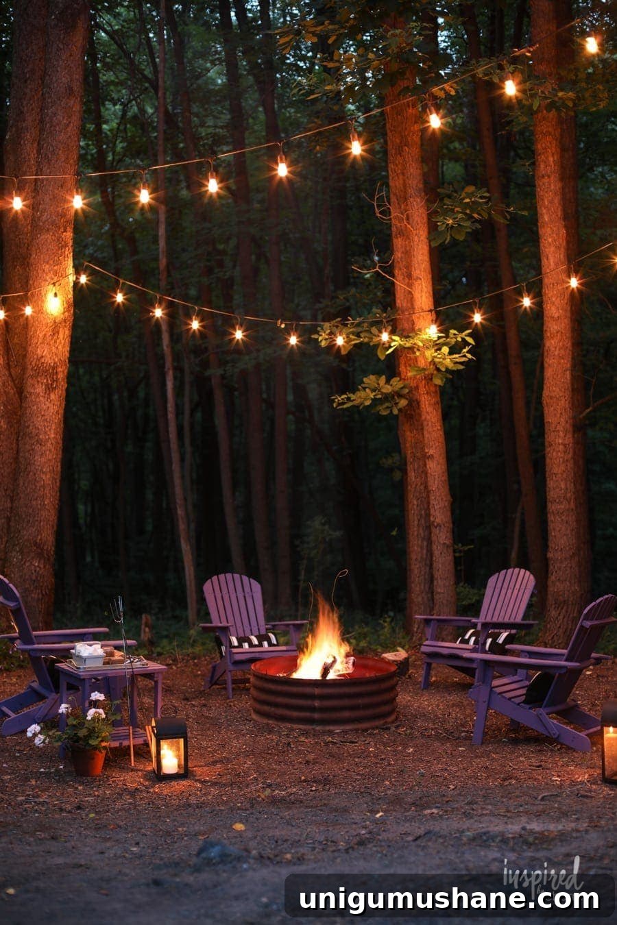 simple fire pit with string lights in trees