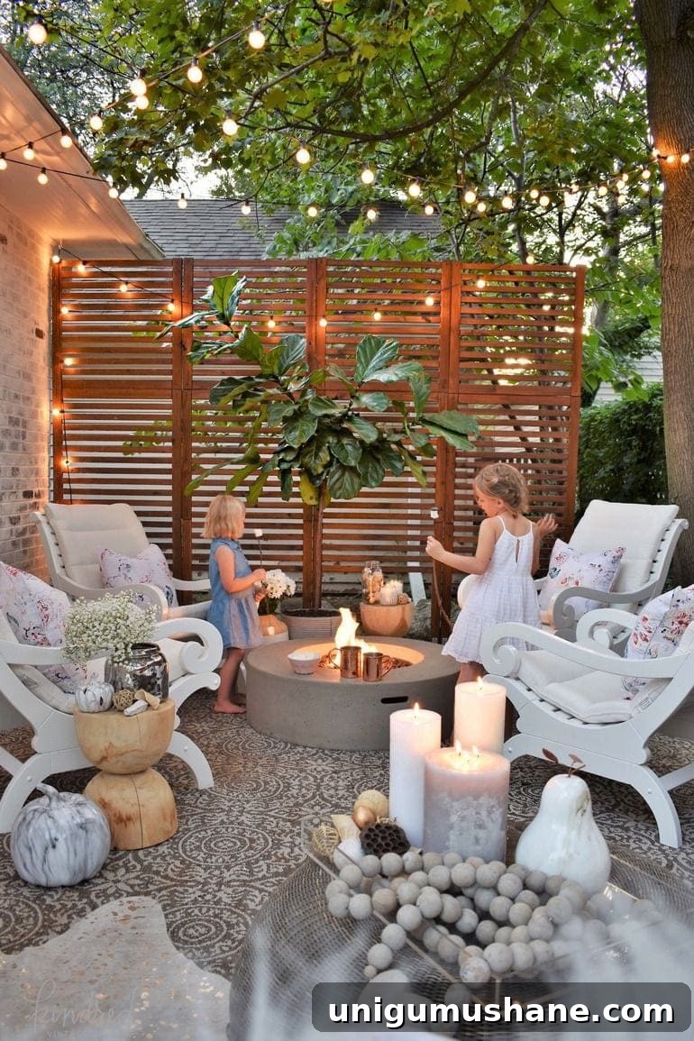 dreamy fire pit with string lights, wood screen, and limewashed brick