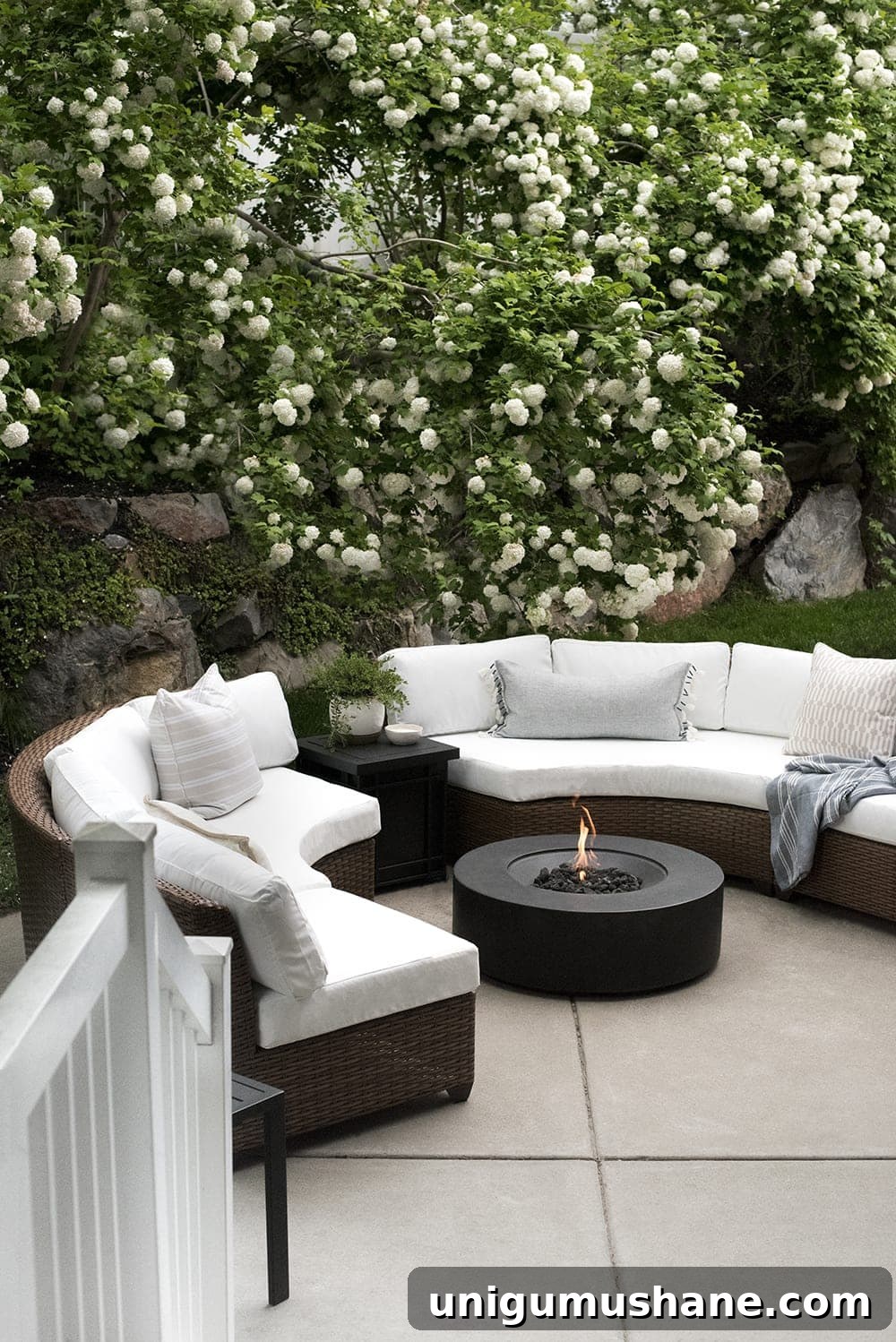 back patio fire pit with curved sectionals