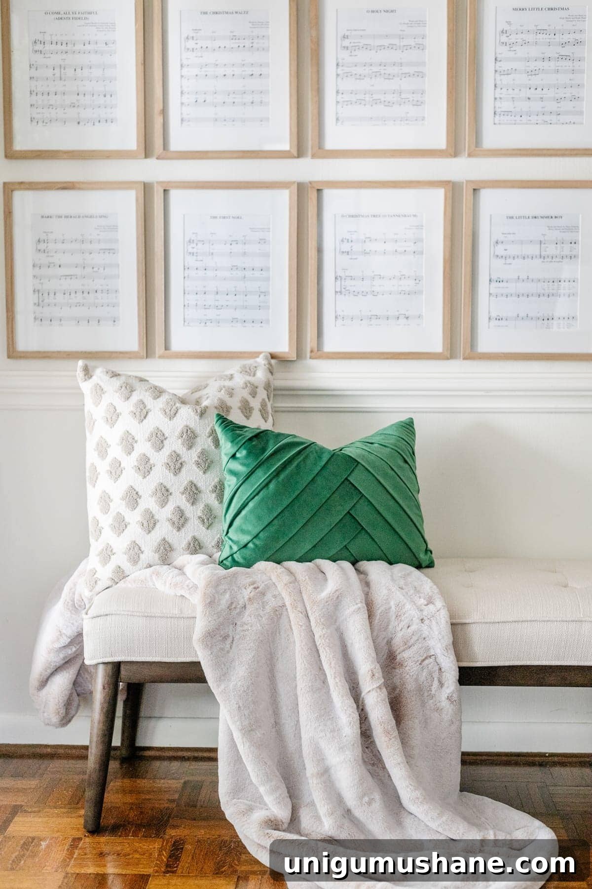 DIY Christmas Sheet Music Gallery Wall Decor 5 Christmas pillows on bench in entryway with sheet music art