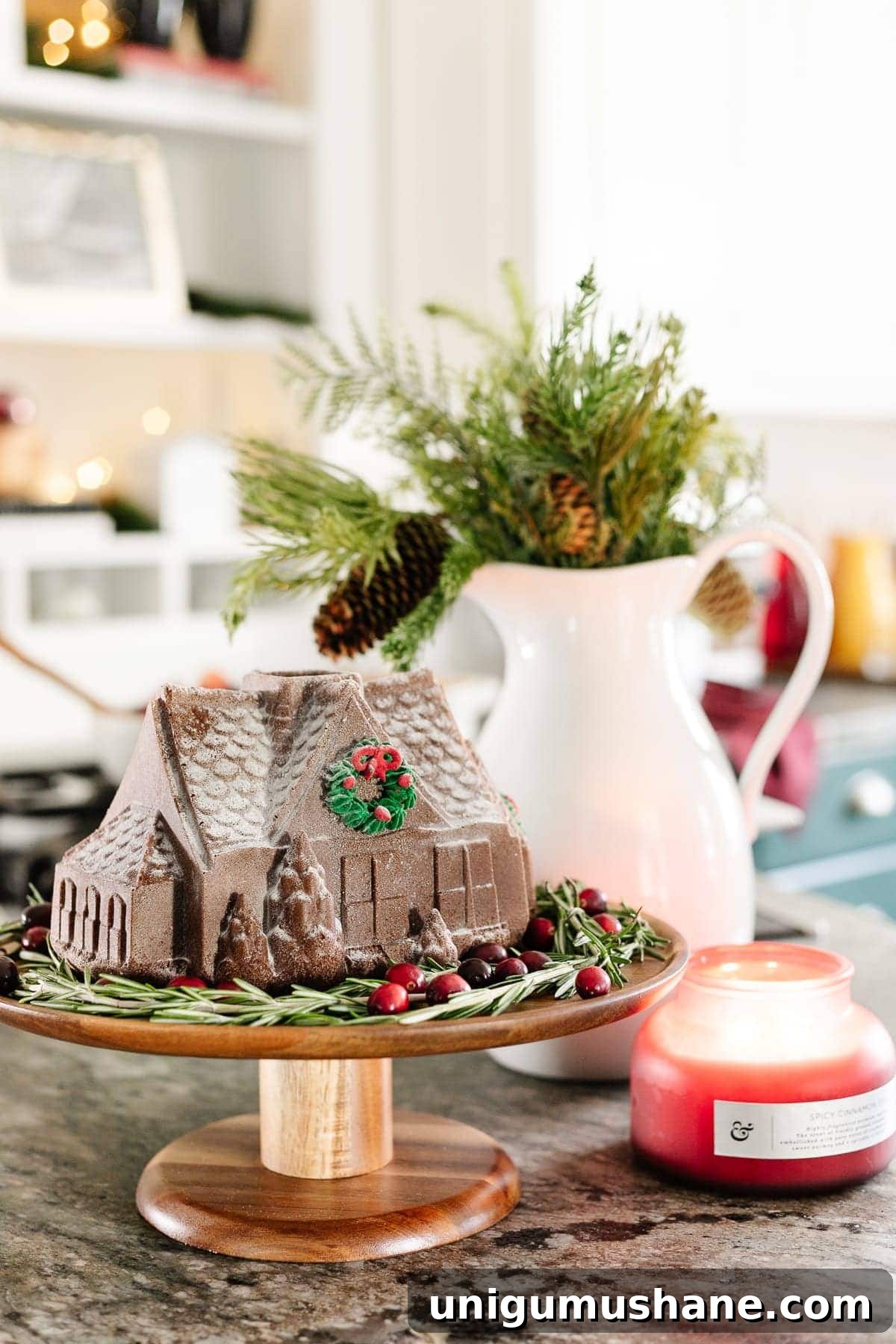 DIY Christmas Brunch Decor Ideas with Printable Art 14 Christmas brunch decor with a gingerbread house on a cake stand