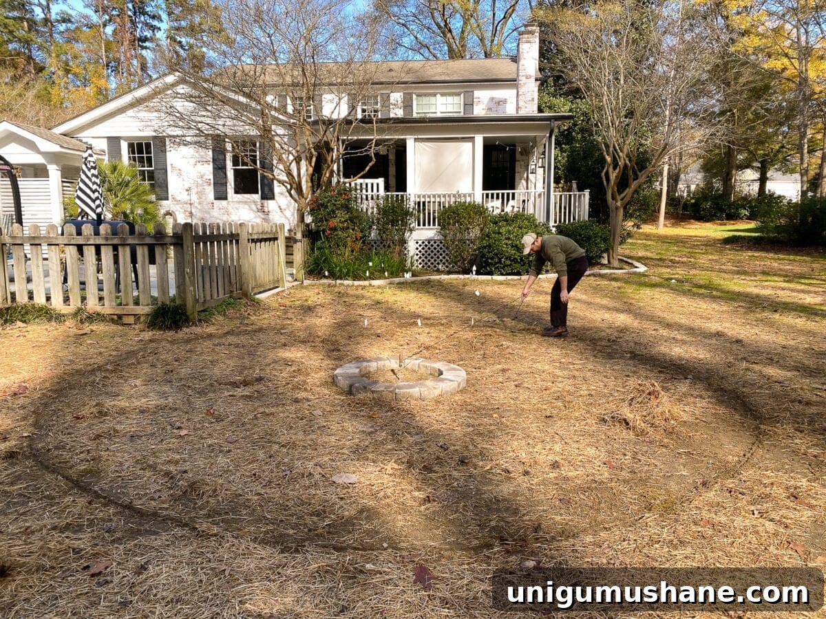 Build a Pea Gravel Backyard Fire Pit in a Weekend 8 marking the layout of a fire pit