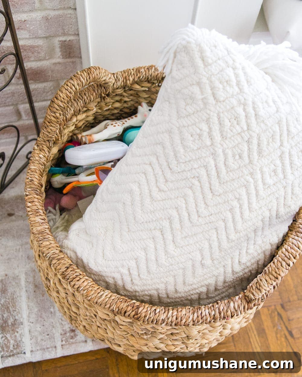 Home Organization Essentials for a Tidy Space 11 Toys in a basket hidden with a pillow on top