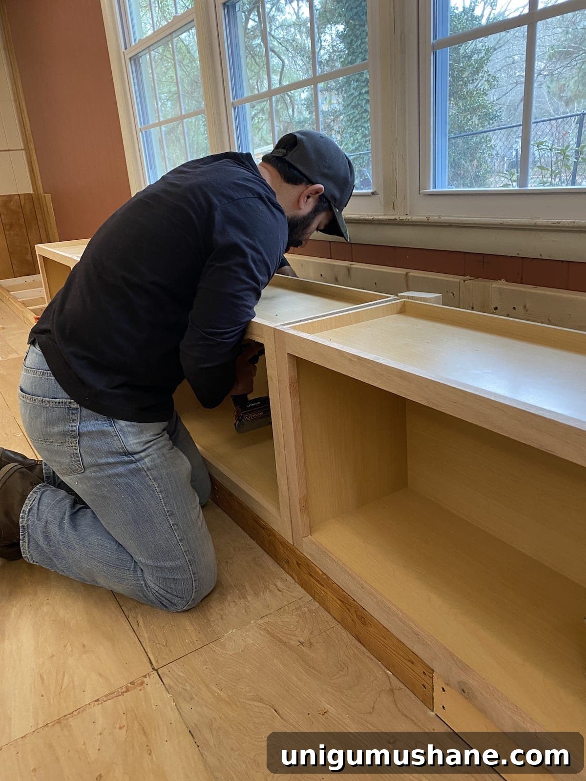 DIY Built-In Cabinets and Window Seat Plans 9 A step-by-step tutorial to build DIY built in cabinets and a window seat using inexpensive stock kitchen cabinets.