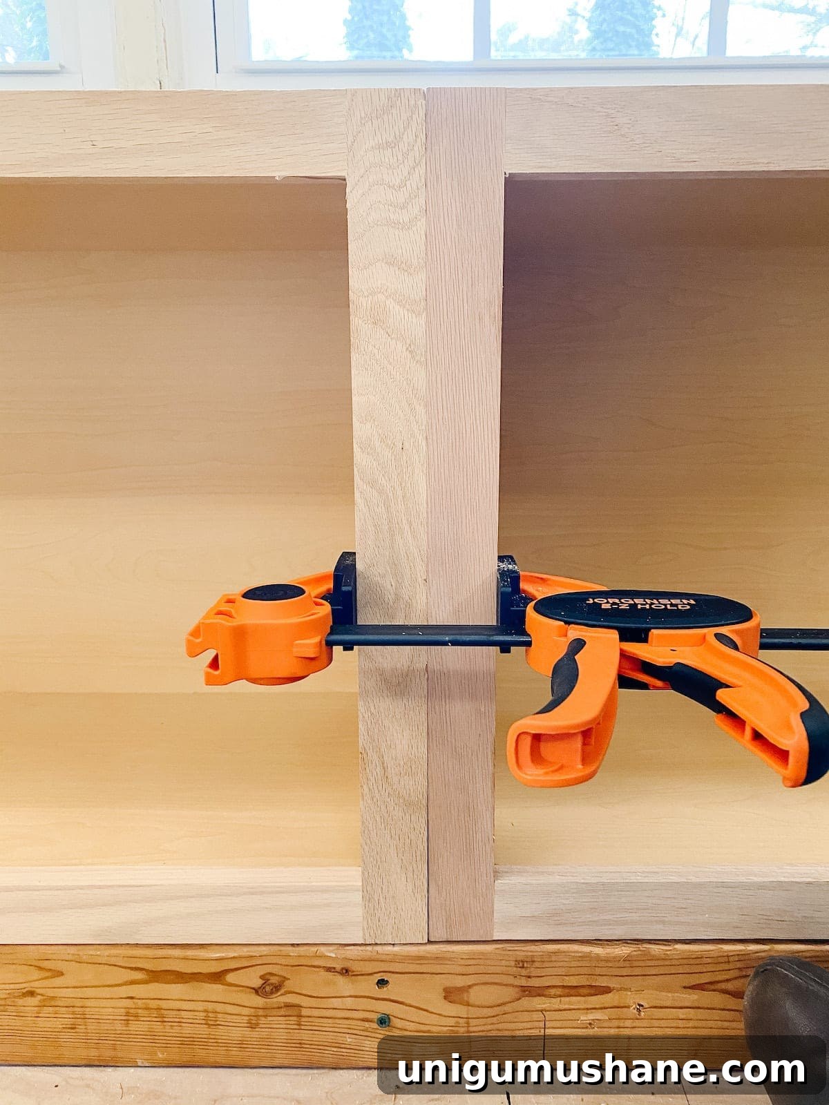 DIY Built-In Cabinets and Window Seat Plans 11 A step-by-step tutorial to build DIY built in cabinets and a window seat using inexpensive stock kitchen cabinets.
