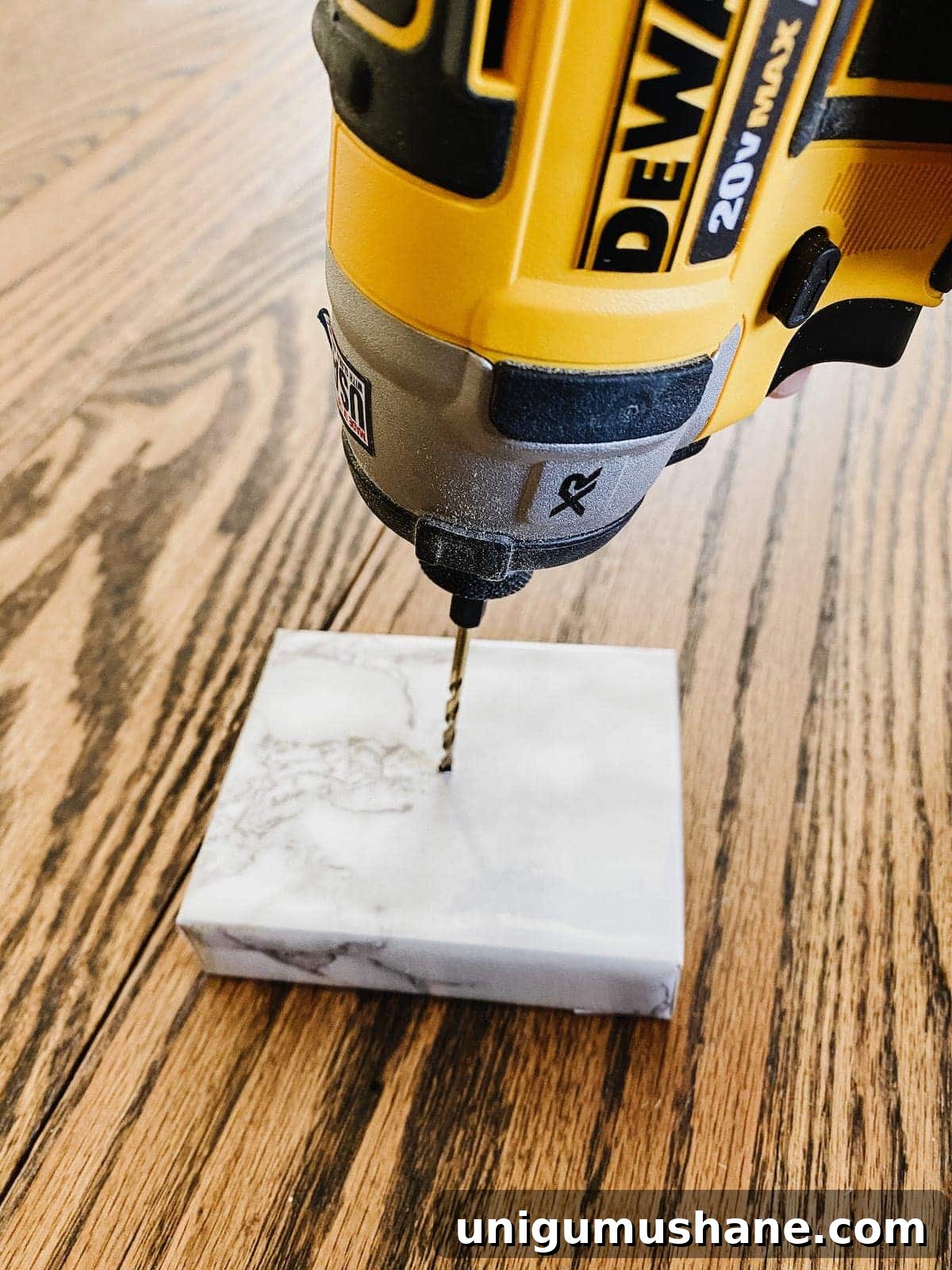 DIY Gold Leaf Sculpture: Designer Dupe for Less 6 Marble-wrapped wood block with drilled hole