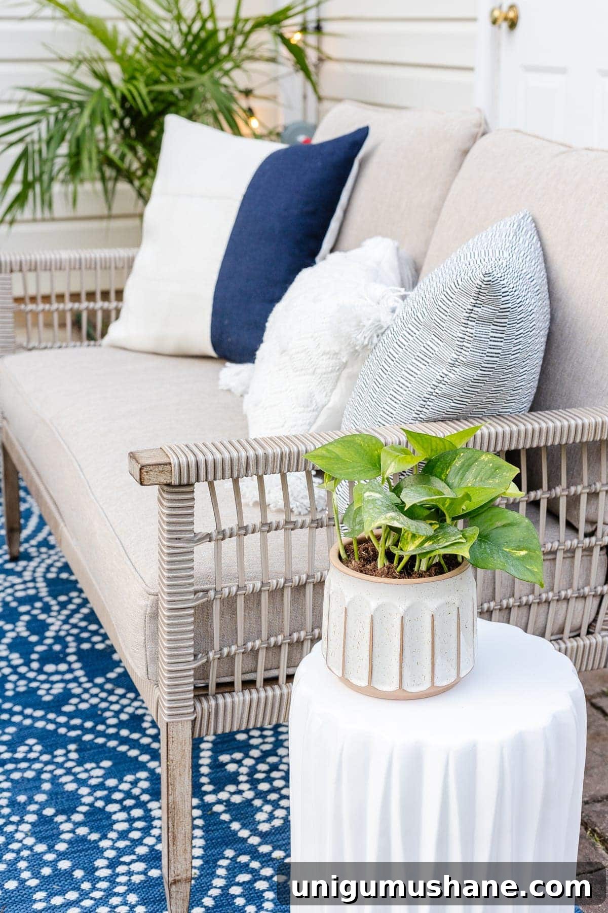 DIY Patio Ideas on a Budget to Transform Your Outdoor Space 11 outdoor sofa with pillows and plants