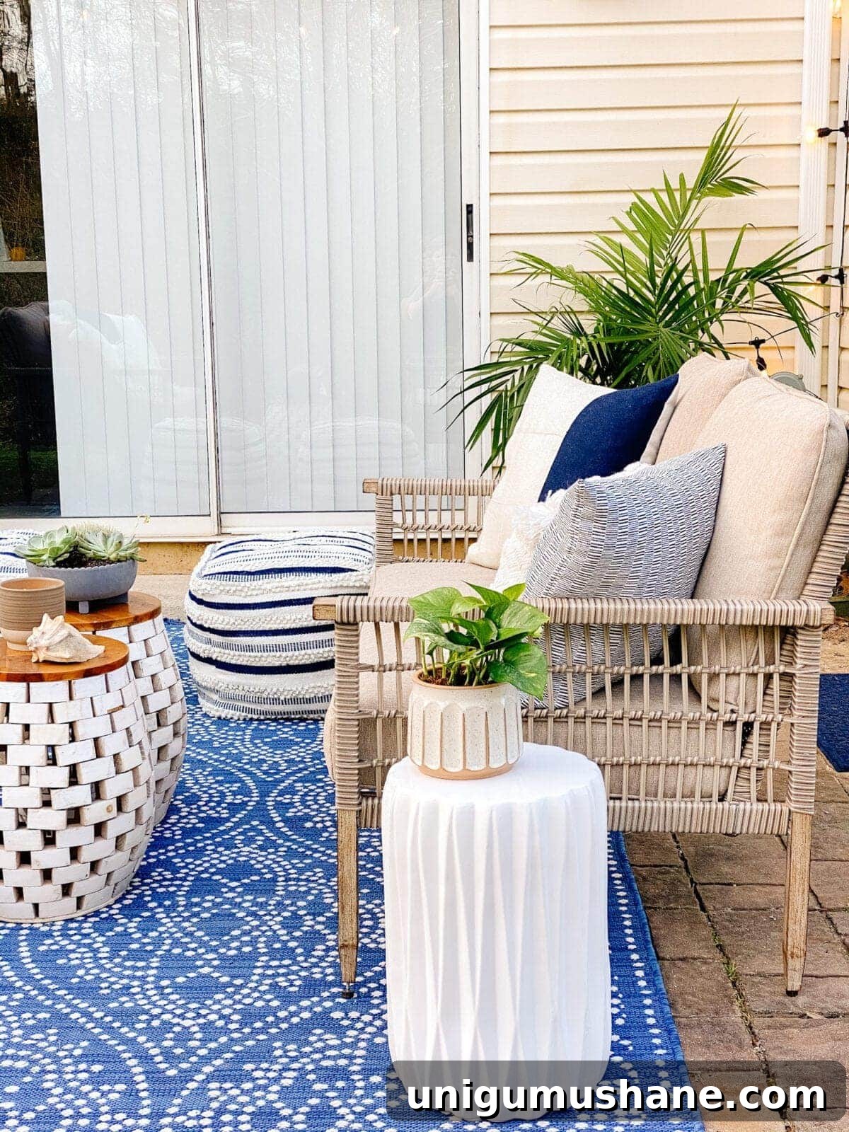 DIY Patio Ideas on a Budget to Transform Your Outdoor Space 12 outdoor loveseat with pillows and palm tree on a patio