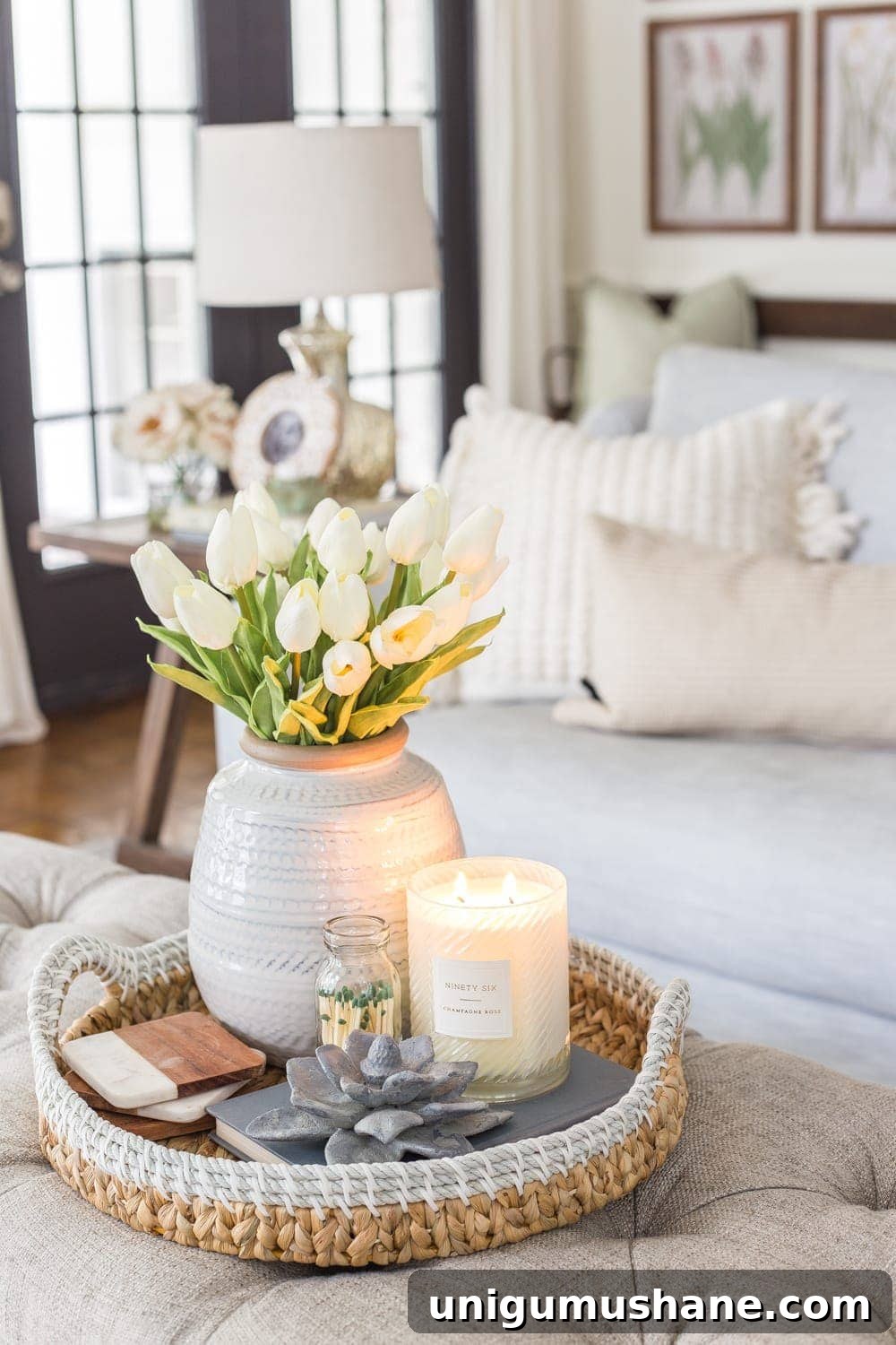 Coffee Table Decor Ideas with Styling Tips 7 spring coffee table idea - vase of tulips, candle, concrete flower figurine, and basket tray