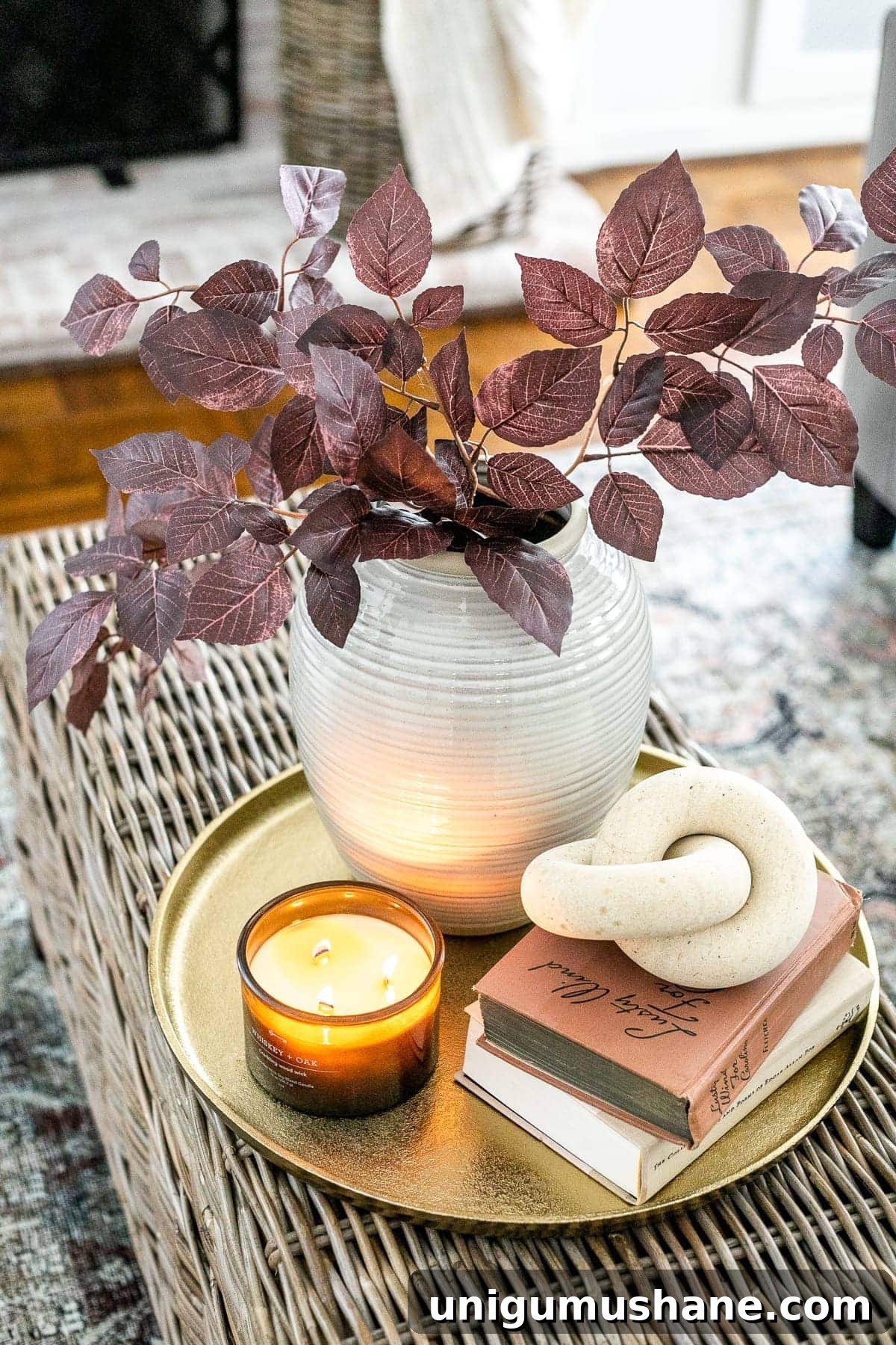 Coffee Table Decor Ideas with Styling Tips 16 fall living room coffee table idea with brass tray, leaves in a vase, wooden knot, and candle