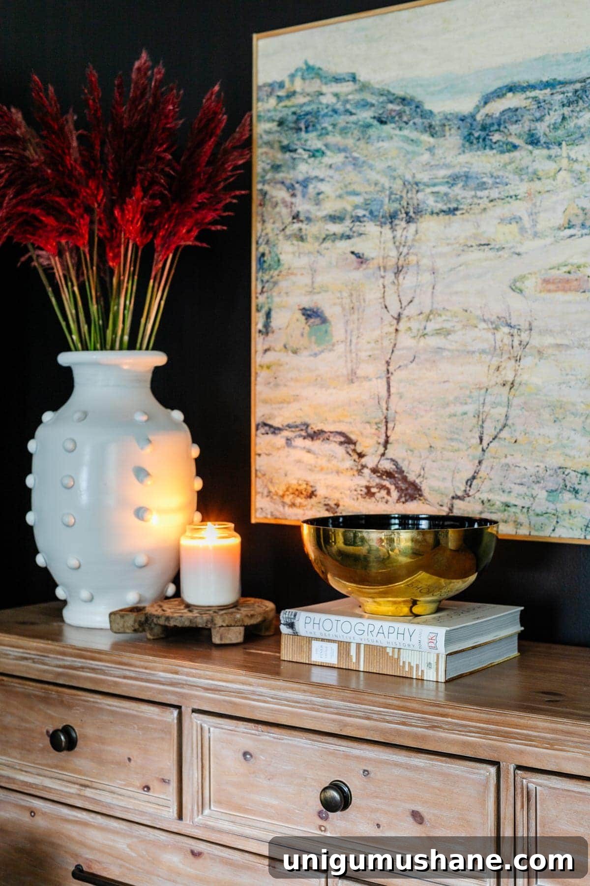 coffee table books styled on a bedroom dresser
