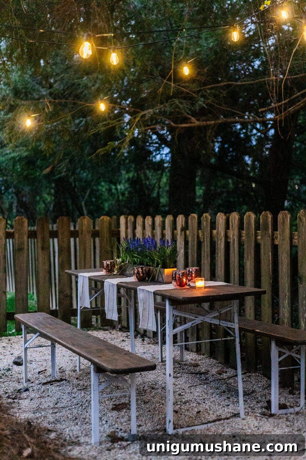 DIY Beer Garden: Transform Your Neglected Backyard 7 folding table and string lights on pea gravel for an inexpensive backyard patio area