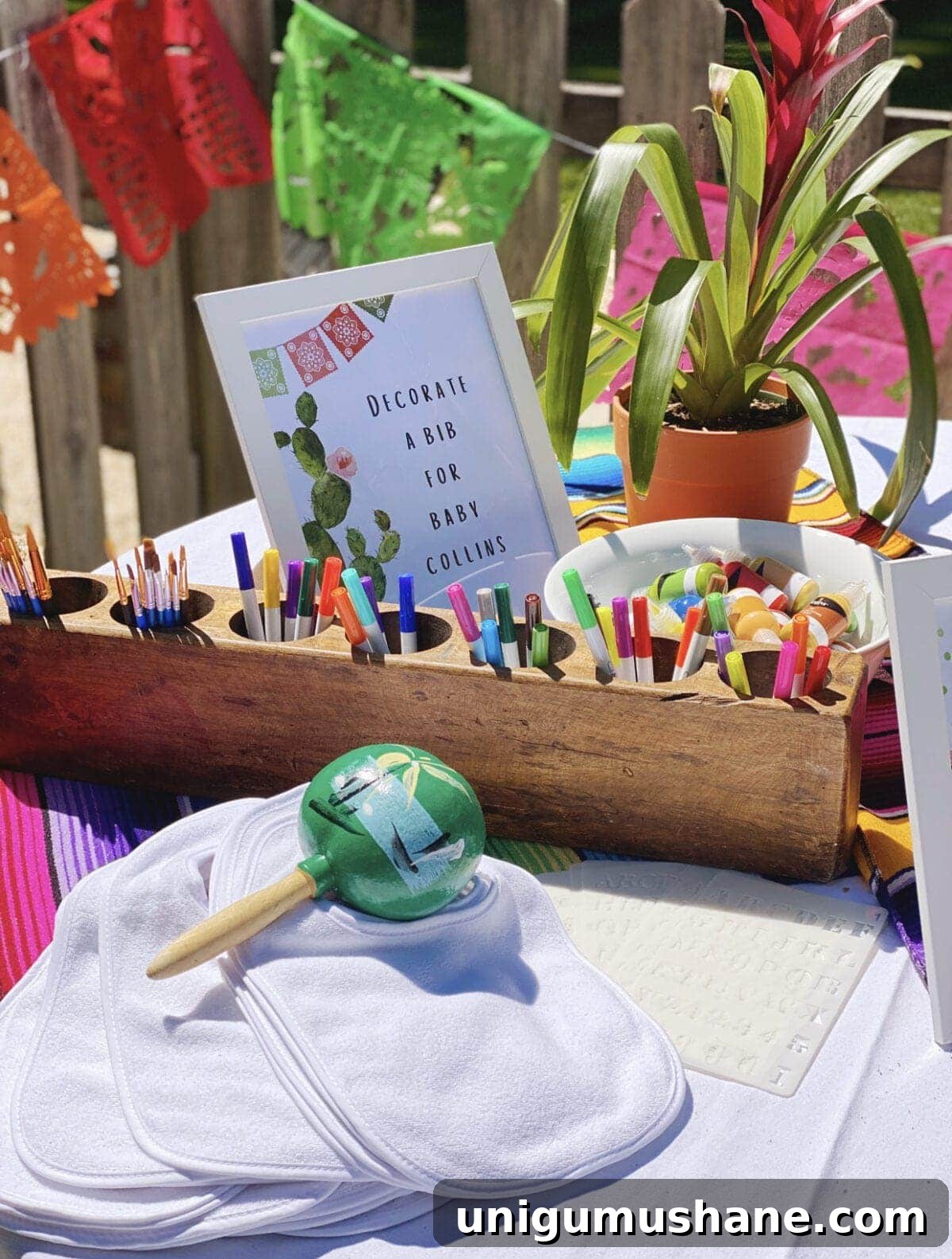 How to Plan a Fiesta Baby Shower: Themes, Decor and Menu Ideas 11 Mexican themed bib decorating station