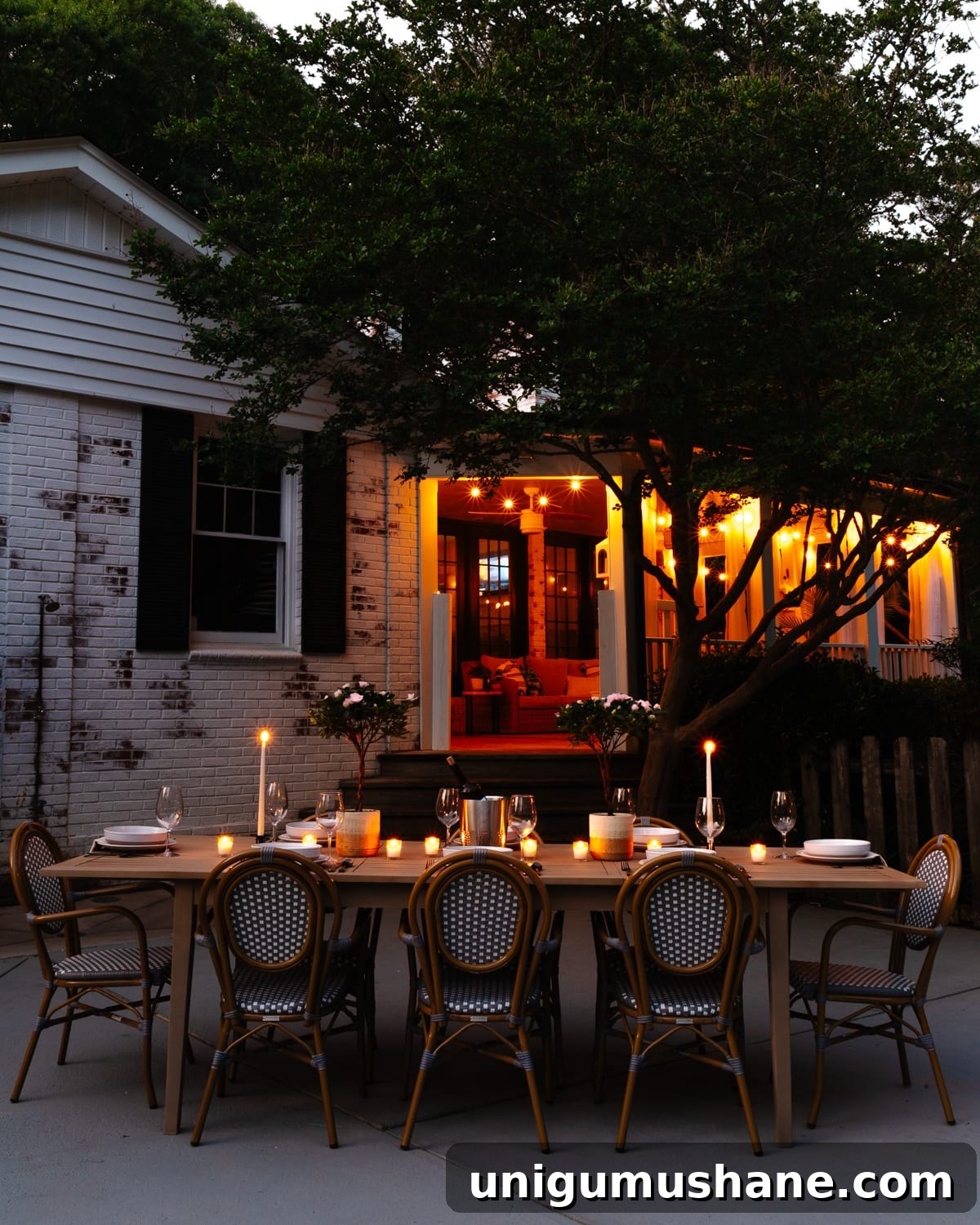night time backyard patio and back porch with string lights and candlelight