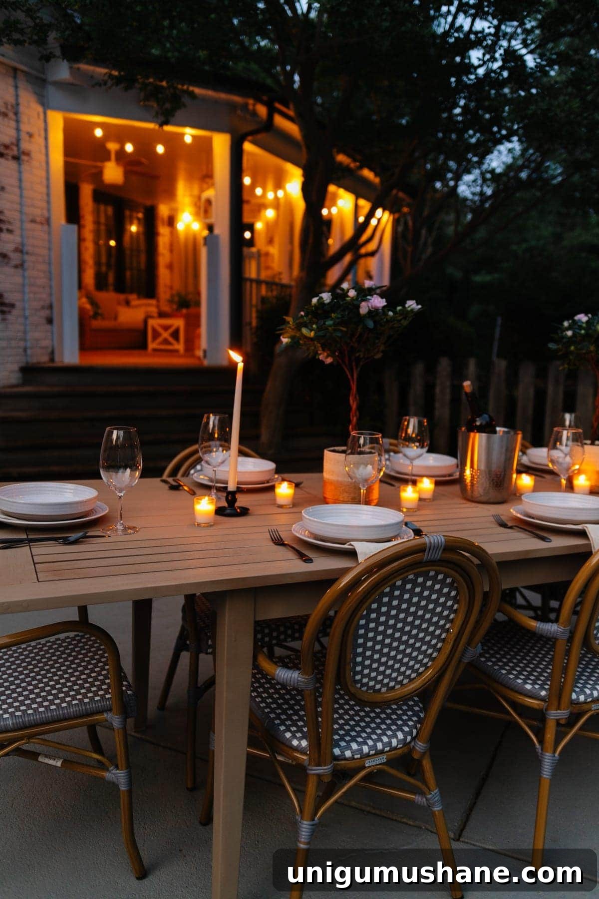 night time backyard patio and back porch with string lights and candlelight