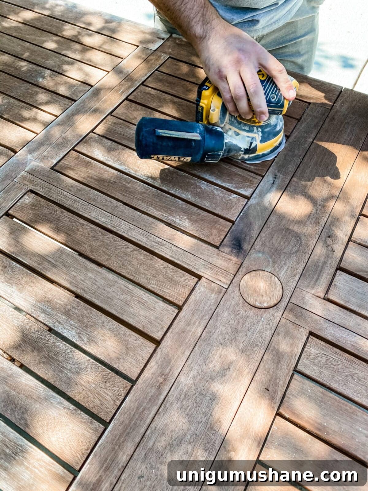 sanding an outdoor table