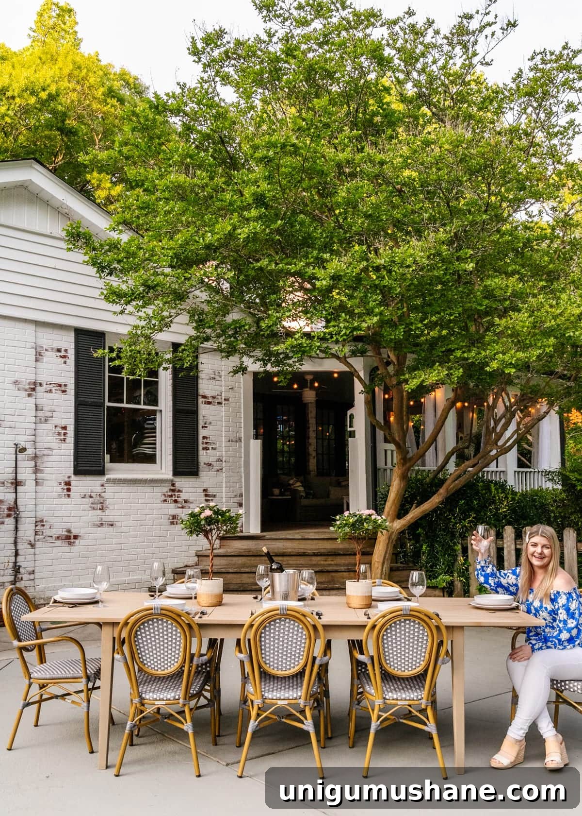 outdoor patio with limewashed brick and dining table