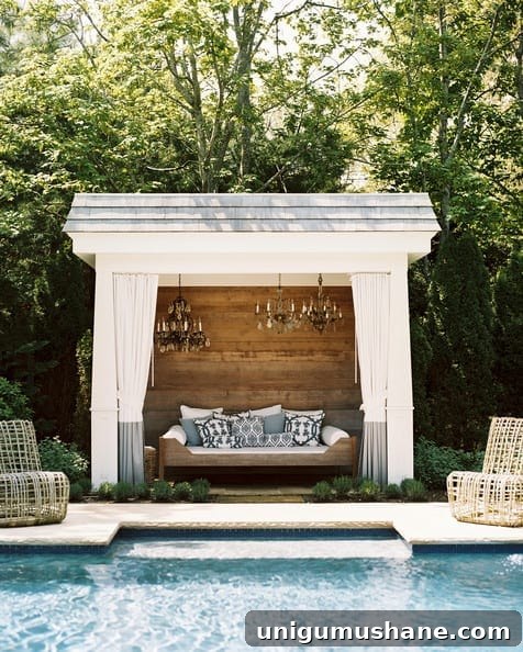 7 Pool Cabana Ideas for Your Next Backyard Project 7 white pool cabana with rustic wood wall