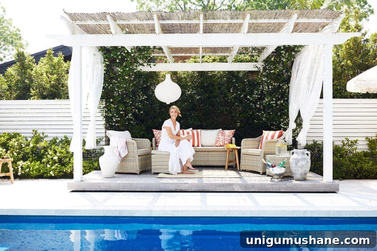 7 Pool Cabana Ideas for Your Next Backyard Project 8 pool cabana with white gauze curtains and rattan outdoor furniture