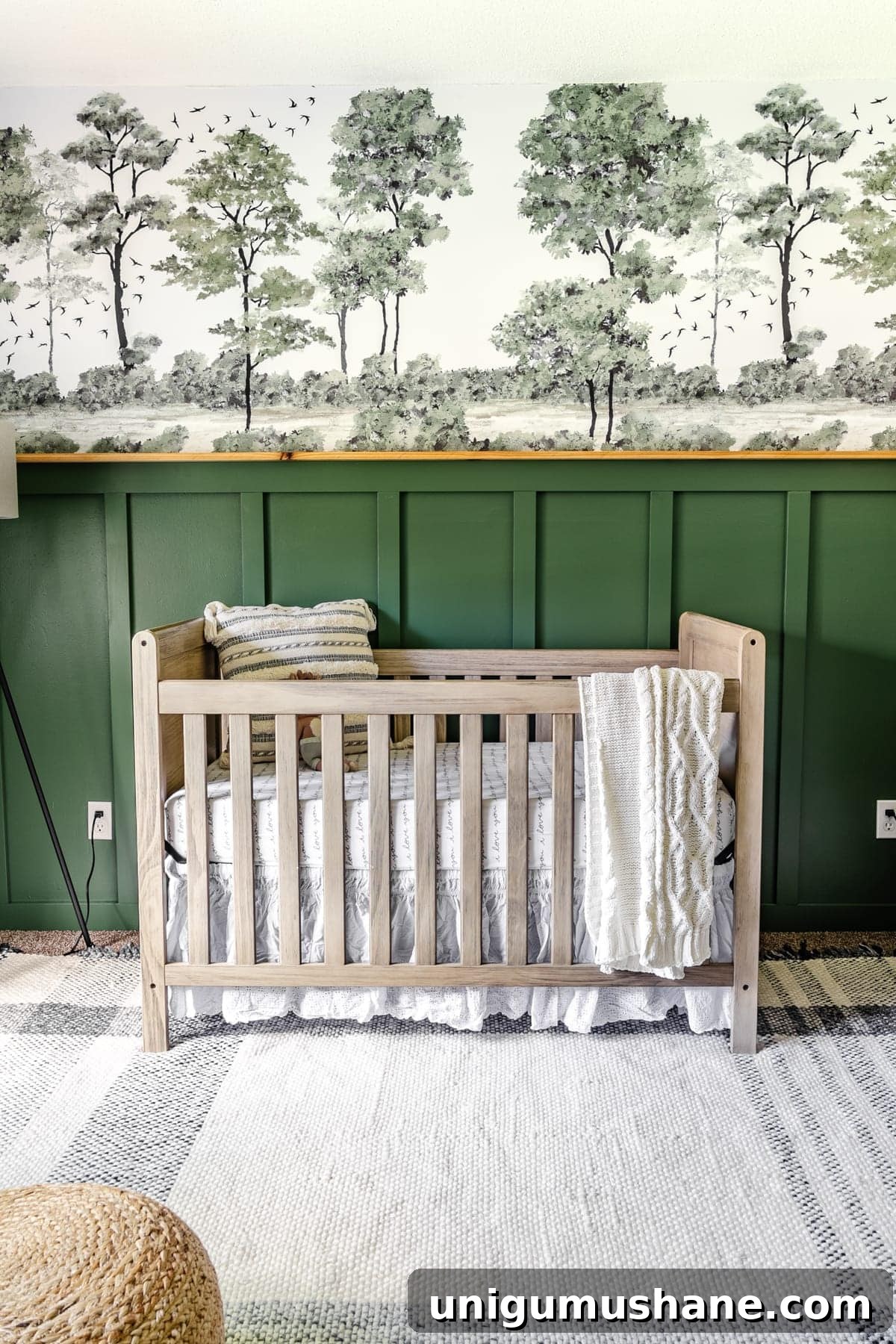 baby boy nursery idea with woodland theme using green paint and peel & stick tree mural
