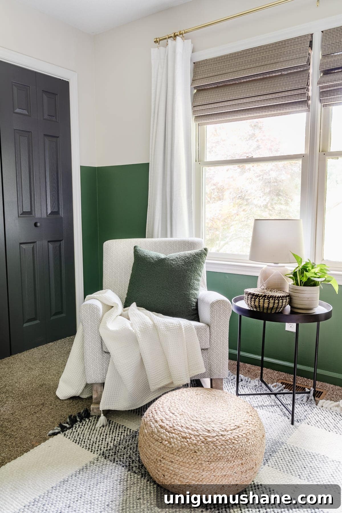 nursery rocker with gray pattern, plaid rug, green paint, blackout curtains, black door, and side table