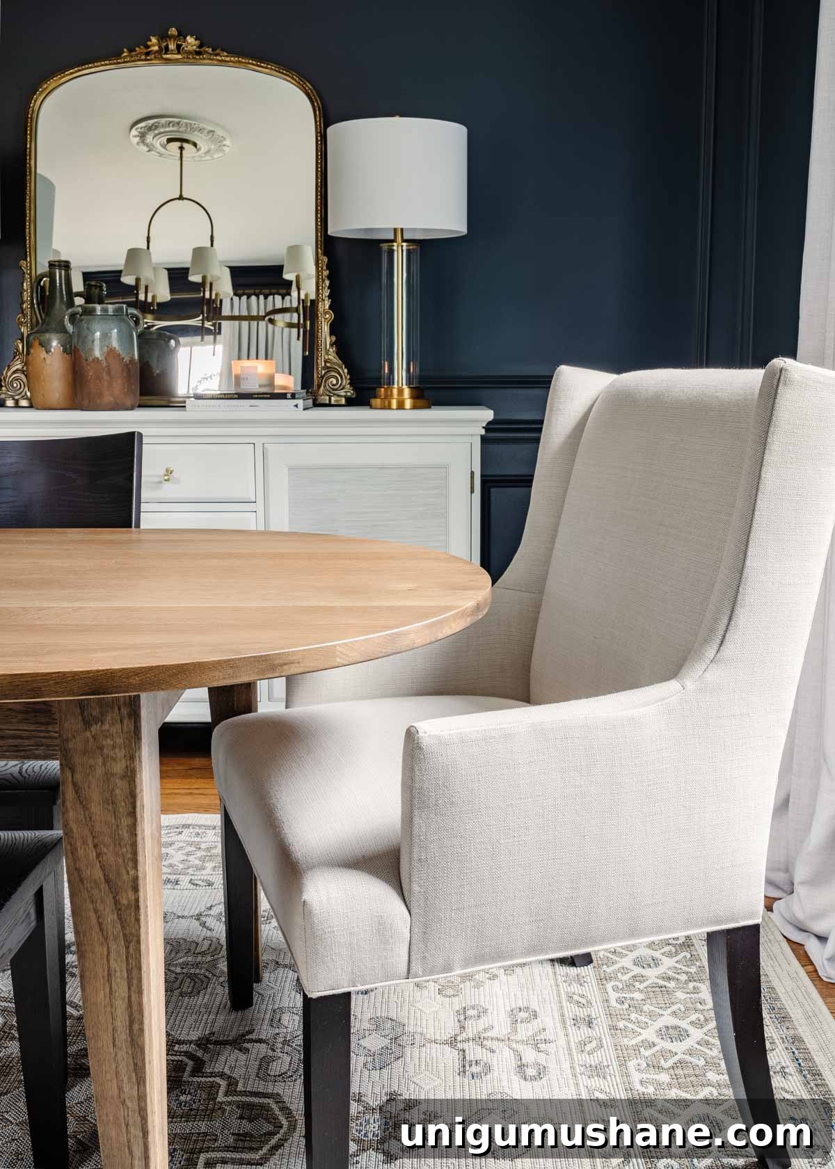 Classic Modern Dining Room Furniture by Bassett BenchMade 9 midcentury modern dining table with upholstered chairs, navy walls, and french mirror