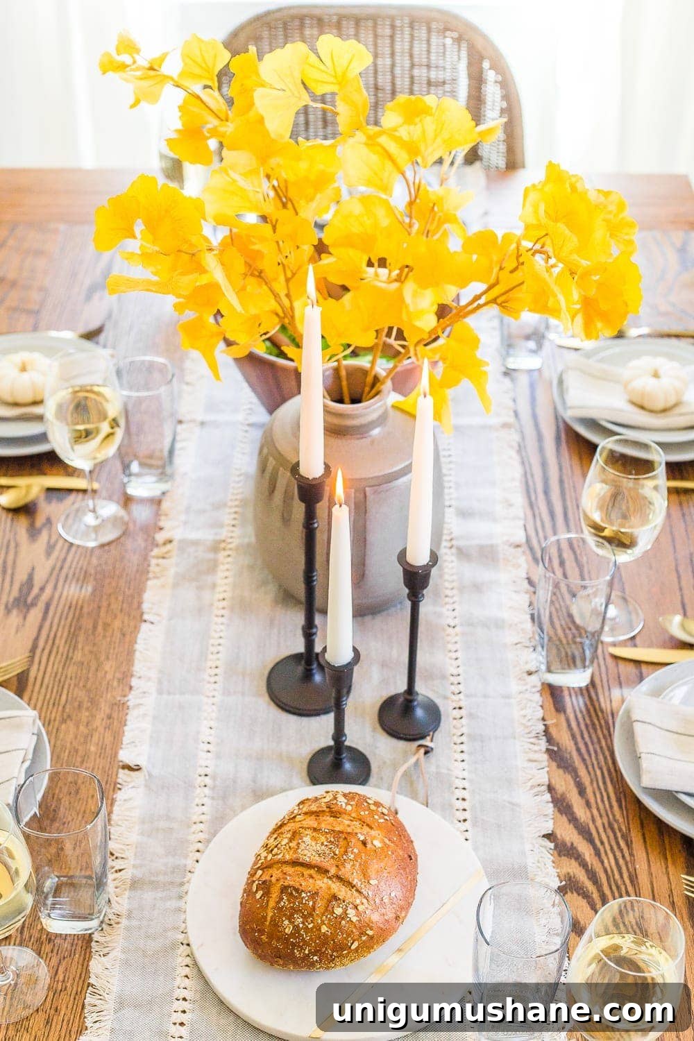 12 Budget-Friendly Fall Decor Ideas for a Luxe Look 9 snipped yellow ginkgo branches from the yard in a vase for cheap fall decor