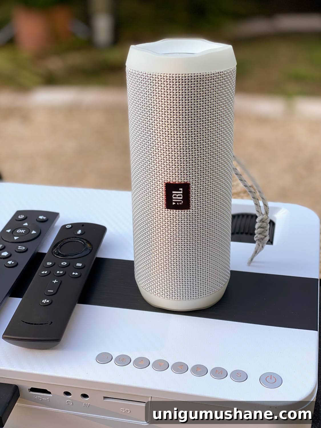 How to Host a Backyard Movie Night on a Budget 11 how to set up a bluetooth speaker with an outdoor movie projector